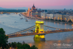 Scenic view of Budapest citylights from Castle Hill with Danube river, Chain Bridge and Parliament Building at twilight