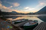 Morning scenery with boats moored on Hintersee lake at sunrise