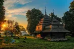 Incredible view of medieval wooden church of Saint Basil illuminated by rising sun, Cherche, Ukraine