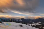 landscape with sunrise light and moving clouds