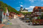 Main street leading to medieval gothic royal Karlstein Castle, Karlstejn, Czech Republic