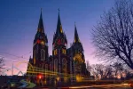 Nightscape of ancient gothic church with autotracks