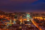 Aerial panoramic view of historical city center at night, Lviv, Ukraine. UNESCO world heritage site