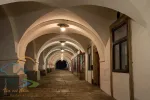 Nightscape of illuminated arcade in renaissance building on Husovo square, Nove Mesto nad Metuji, Czech Republic