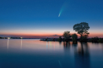 Comet C 2020 F3 Neowise in night sky above Dnieper river, Ukraine