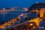 Scenic view of Budapest city at blue hour with illuminated Buda Castle, Citadella on Hellert Hill and Danube embankment