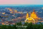 Scenic night scape of St. Stephen's Basilica, ferris wheel and Pest district in Budapest, Hungary