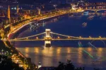 Scenic night view of Chain Bridge and embankment on Danube river in Budapest, Hungary