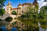 Amazing view of Vajdahunyad Castle reflected in the water in main City Park, Budapest, Hungary
